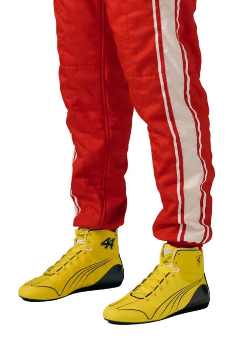 Yellow high-top racing-style shoes worn with red racing trousers