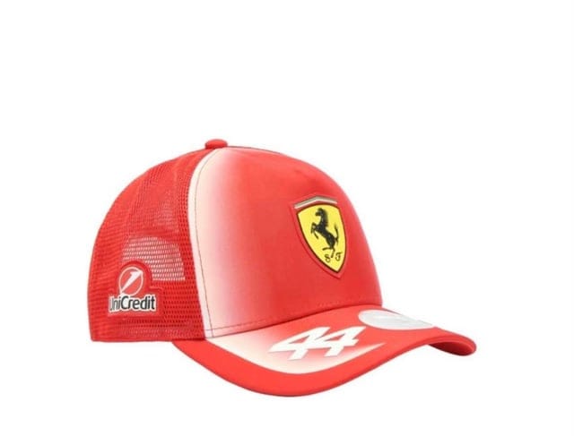 A red Ferrari trucker cap featuring the yellow prancing horse logo on the front, a white &