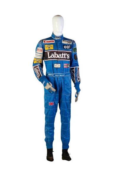 Nigel Mansell 1992 Williams F1 Racing Suit in royal blue with embroidered sponsor patches, black and white accents, and British flag detail.