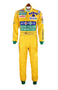 Michael Schumacher 1992 yellow racing suit with green cuffs, multiple sponsor logos, quilted stitching, and embroidered nameplate at waist.