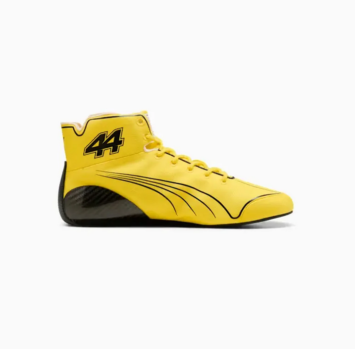 Side view of yellow high-top racing-style shoe with black lines and number 44