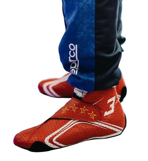 Red high-top racing-style shoes shown on foot from the side