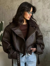 Woman wearing a casual dark red zipper leather jacket with a sleek finish and zip closure