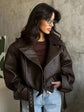 Woman wearing a casual dark red zipper leather jacket with a sleek finish and zip closure